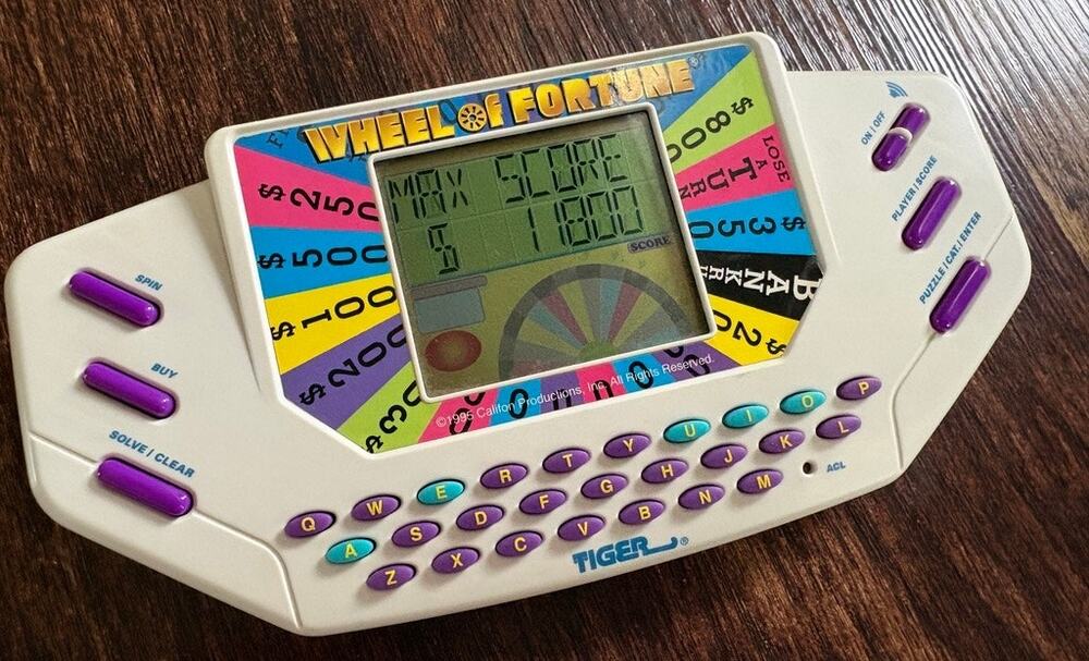 1995 Tiger Electronics Wheel Of Fortune Handheld LCD Video Game Plus Cartridge 1